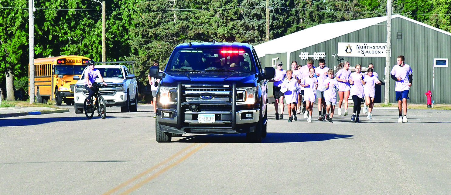 Sheriff escort accompanying runners during the Run to Remember